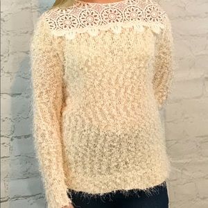 Brand new furry sweater with cut outs along the neckline.
